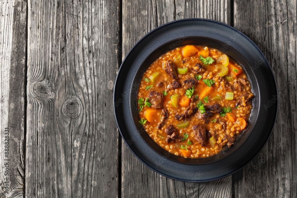 Canvas Prints beef barley soup in a bowl, top view