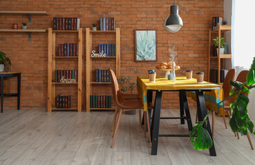 Interior of coffee shop with table and bookshelves