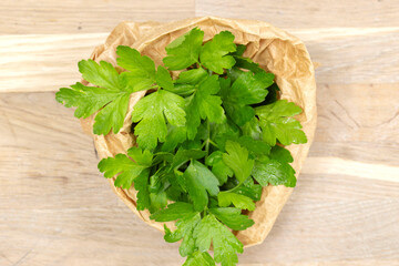 Parsley, freshly picked, in a brown paper bag. Eco friendly recycle packaging