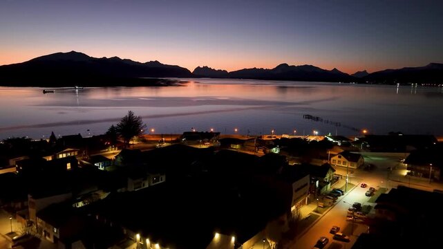 Sunrise City At Puerto Natales Antarctica Chile. Aerial View Of A High-Rise Buildings And Traffic Showcasing Urban Life. Sunset Snowing Day Illumination Swiss Alps Frozen Background.