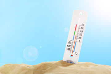 Thermometer Measuring High Temperature in Sand on Sunny Day