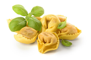 Raw dumplings and basil on white background