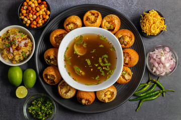 Exploring the Tangy, Spicy, and Refreshing Delight of Pani Puri. India's Favourite Street Food Experience. Selective focus. 