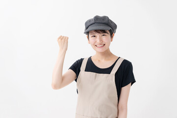 ガッツポーズする飲食業女性