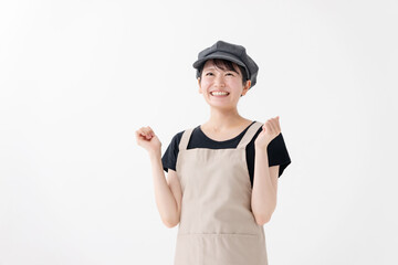 ガッツポーズする飲食業女性