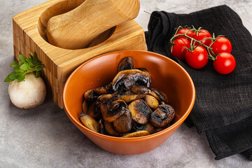 Roasted champignon mushrooms in the bowl