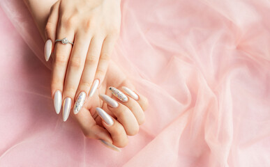 Female Hands with beautiful pearl manicure