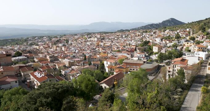 Skyline Of Scenic Town Dorgali In Sardinia, Italy. Tracking Aerial Shot.