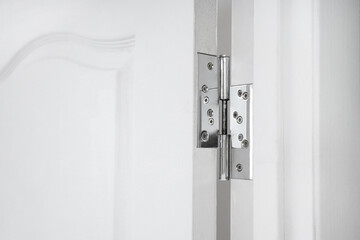 Connection of door and hinge at home, closeup