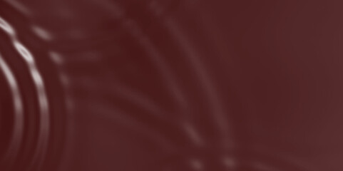 Brown liquid top view. Water surface with gentle ripples and concentric rings, the water surface is clear brown with waves. Colorful liquid top view. Spa concept background. Flat lay, copy space.