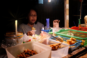 Woman enjoying fried tofu at 