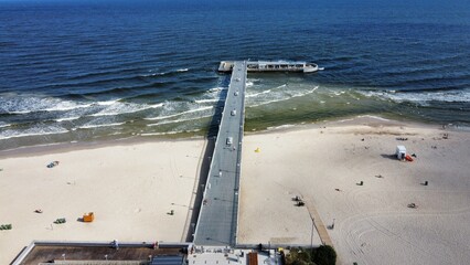 boat on the beach and molo in Kołobrzeg 