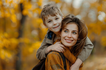 Happy mother and son in the autumn park. The concept of a family holiday.