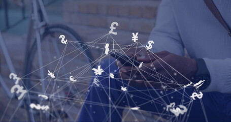 Image of connections and currency symbols over biracial man using smartphone