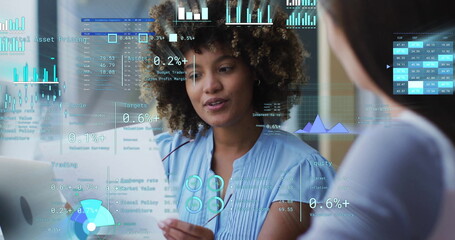 Image of financial data processing over diverse business people in office