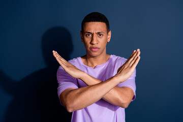 Photo portrait of young funny guy with short haircut wear stylish purple t shirt has veto reaction...