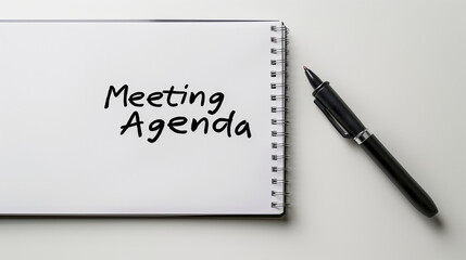 meeting agenda slide with pen and notebook