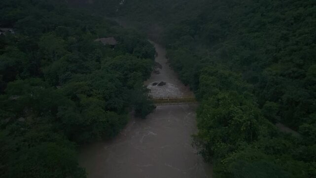 Aerial view of lush greenery and untamed river flowing through dense forest, Semuc Champey, Alta Verapaz, Guatemala.