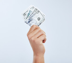 Hand, cash and investment in studio for budget, banking and growth or savings for freedom. Person,...