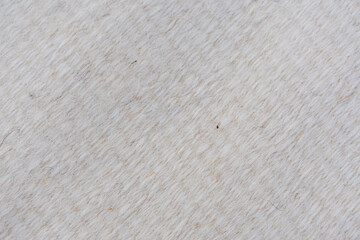 Handwoven beige wool carpet background texture, copy space