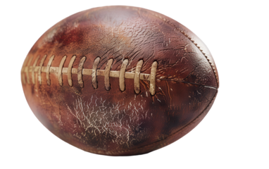 A vintage leather football with visible wear and tear, showcasing the history of countless games