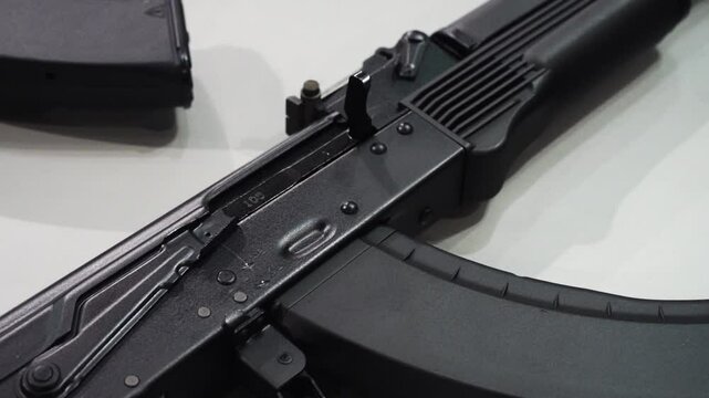 Machine guns and machine guns at a military weapons show. Black modern machine guns for the army and police. Arms trade concept.