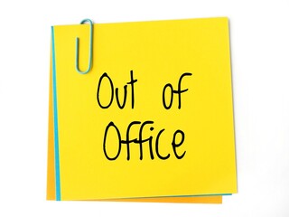 A yellow sticky note with the handwritten text Out of office in black letters. Is it correct:...