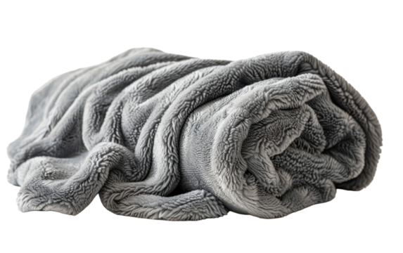 A cozy grey fleece blanket rolled up for a comfortable evening