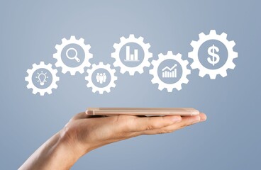 Businessman pointing on a virtual screen with usiness icons