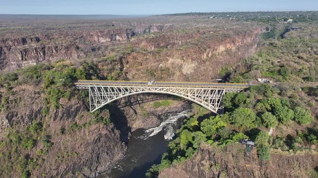 Victoria Falls Bridge At Victoria Falls Matabeleland North Zimbabwe. Aerial View Of Landmark Bridge Showcasing Its Intricate Design . Rural Road Valley Farming Amazing. Farming Tropical Countryside.