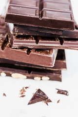 Stack of chocolate bars on white background for dessert concepts