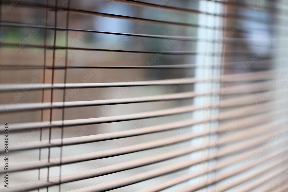 Aufkleber A close-up view of a window with its blinds shut.