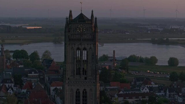Aerial view of Sint-Maartenskerk, bridge, and river at sunset, Zaltbommel, Netherlands.