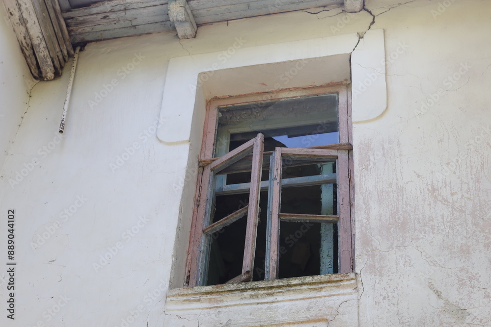 Aufkleber a picture of a window with a wooden frame on the side of a white building.