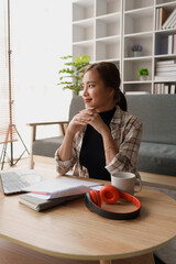 woman meticulously plans a finance audit, using a computer and calculator to review budget...
