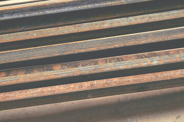 A pile of old scrap iron. Angles, pipes, slats, planks