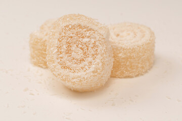 Coconut candy roll isolated on a white background.
