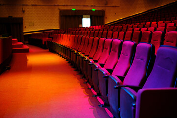 View theater seats before a performance or concert, hall for spectators. red rows. in the theatre....