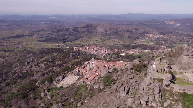 Aerial view of medieval village with mountains, rocks, ruins, and castle, Monsanto, Castelo Branco, Portugal.