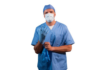 Portrait of a physiotherapist in light blue gown looking at camera in studio.