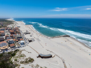 Beautiful Atlantic ocean beach by the coasts of Portugal near cities of Aveiro and Nazare. Sunny...