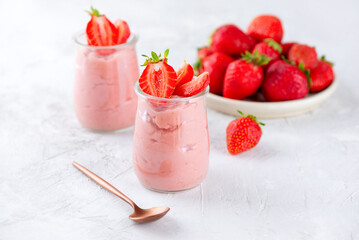 Mousse tofu soy dessert with strawberry in a glass. Vegan homemade breakfast. Lactose and sugar free.
