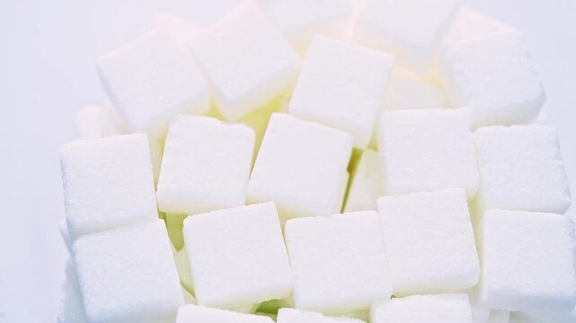 High angle view rotation of sugar lumpy close-up