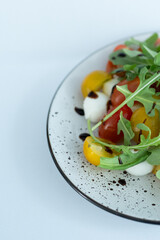 A collection of fresh, organic ingredients including cherry tomatoes, cucumbers, and greens, perfect for a healthy vegan salad or detox snack, beautifully plated and ready to enjoy