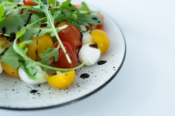 A collection of fresh, organic ingredients including cherry tomatoes, cucumbers, and greens, perfect for a healthy vegan salad or detox snack, beautifully plated and ready to enjoy