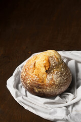 Delicious homemade round bread in the shape of a volcano. Still life in a rustic style