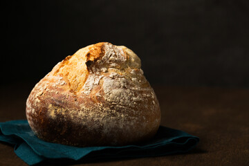 Unleavened round bread in the shape of a volcano. Still life in a rustic style