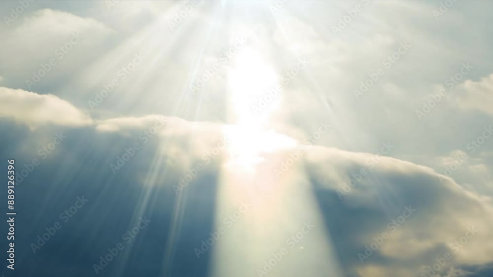 Aufkleber The sky is cloudy and the sun is shining through the clouds. The sun is casting a warm glow on the clouds, creating a peaceful and serene atmosphere