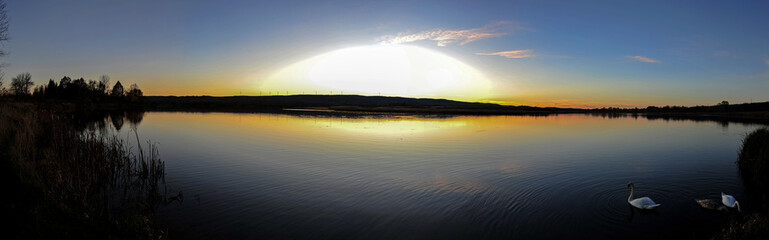 Panorama lake view in sunrise time .Sunrise at the lake