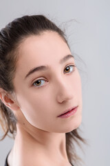 Fototapeta premium Young woman with nose piercing posing in studio